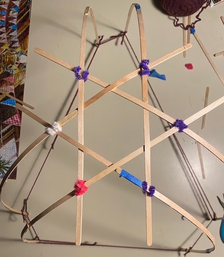 Top down view of mid-build tetrahedron. It is bent in shape using string